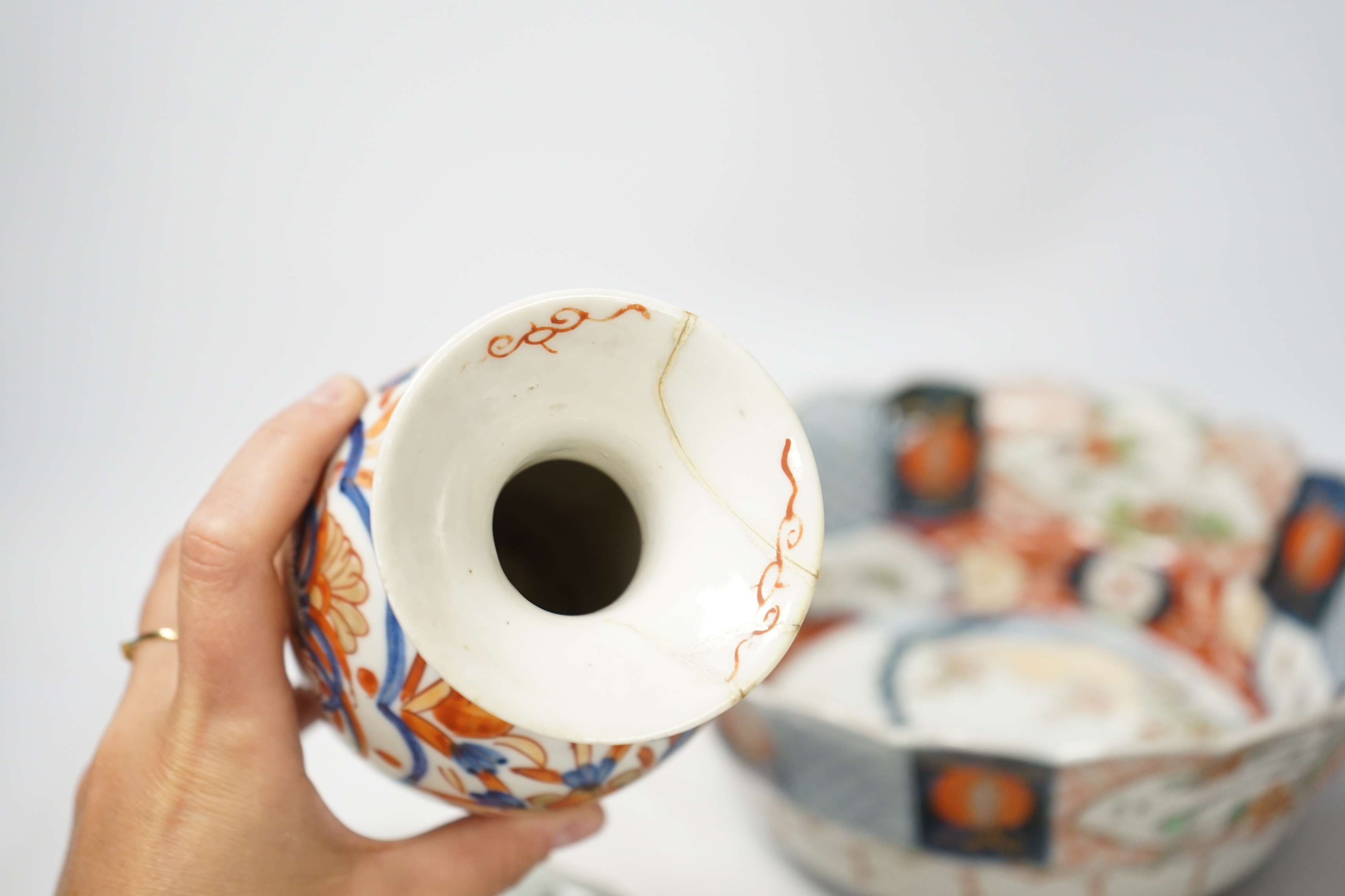 Japanese ceramics to include an Imari vase and bowl and a blue and white dish, 22cm diameter. Condition - two bowls and dish good, others poor